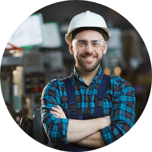 Adult male with a hard hat on in a factory setting