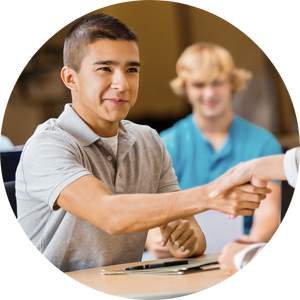 Young man shakes a hand of an adult