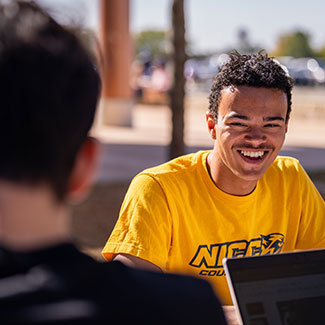 Male outside on campus