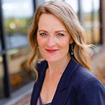 A professional headshot of Dr. Emily Logan