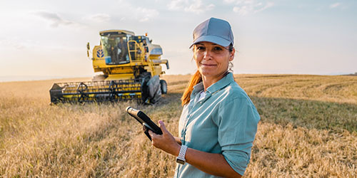 A female agronomist working in the field