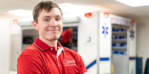 Paramedic student work in the simulation ambulance.